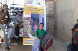 The "Palestine Charity Association" distributes aid to Palestinians in Al-Muzireeb south of Syria.