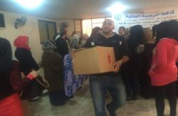 Food aid distribution to PRS in Al-Baddawi Camp.