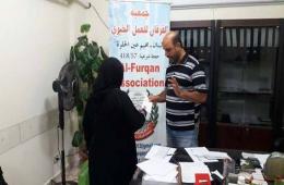 Aid envelopes handed out to Palestinian-Syrian families in Ein Al-Hiwleh Camp