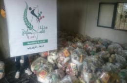 Distribution of food parcels to Palestinian families in southern Syria