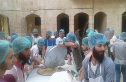 Distribution of Iftar meals to a number of families in the Handarat camp