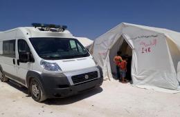 The Palestinian-Syrian Authority for Relief and Development prepares ambulances for the displaced in the Deir Balout camp, north Syria