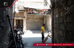 Shopkeepers in Palestinian Refugee Camp in Syria Forced to Post Pro-Regime Banners