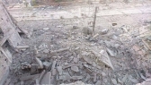 الدمار في شارع الـ 30 في مخيم اليرموك بدمشق