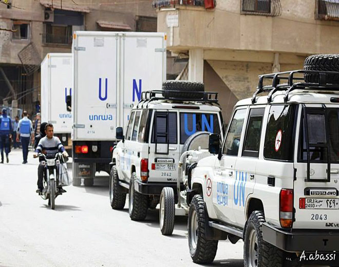 الأونروا وجفرا توزعان مساعدات إغاثية على أهالي مخيم اليرموك في يلدا 