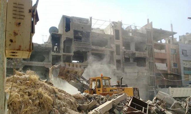 نشطاء يطالبون بإعادة تنظيف مخيم اليرموك من الركام
