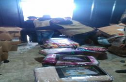 توزيع مواد غذايئة وأغطية على فلسطينيي سورية في مخيم البداوي