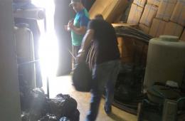 توزيع مساعدات على فلسطينيي سورية في مخيم البداوي 