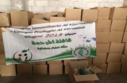 قافلة "المرحمة" تستمر بتوزيع مساعداتها على أهالي اليرموك في بلدة يلدا