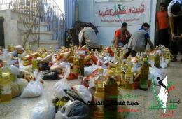 توزيع مساعدات غذائية على أهالي اليرموك النازحين في يلدا