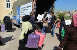توزيع مساعدات على فلسطينيي سورية بمنطقة وادي الزينة 