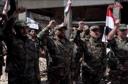 النظام ينشر صوراً لرفع علمه فوق محكمة مخيم اليرموك بدمشق 