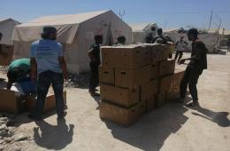 توزيع بعض المساعدات في مخيم دير بلوط والمحمدية
