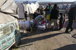 توزيع مساعدات إغاثية في مخيمي دير بلوط والمحمدية 