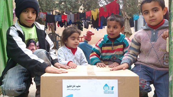 Al Wafaa Foundation distributes aids at Khan AL Sheih camp in Damascus suburb.