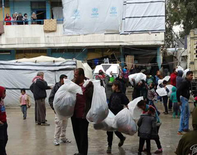 Palestine Charity Association distributes aid to refugee families in Almozaireeb in south country.