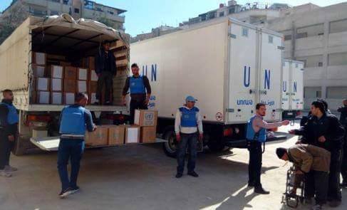 Food aid distribution to displaced families of Al-Yarmouk Camp.