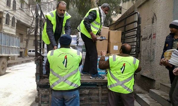 Yarmouk students displaced to Yalda receive textbooks  