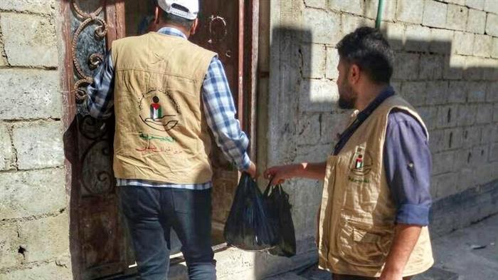 Food Aids, Break-of-Fast Meals Distributed to Palestinian Refugees in Syria