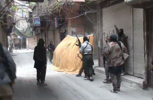 Clashes between ISIS and “Tahrir Al-Sham” continue in Yarmouk camp