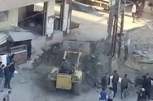 Clashes between ISIS and the regime at the entrance of Yarmouk camp, and the opposition closes the final port for the camp with dirt mounds
