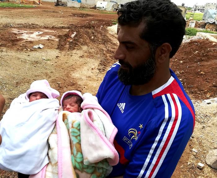 A displaced Palestinian family from Yarmouk camp gives birth to twins in the northern Syrian city of Azaz