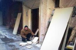 Cold and Siege Force the Residents of the Yarmouk Camp to Smash their Furniture for heating.