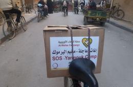 Food Aid Distribution Continues in the Yarmouk Camp and an Imminent Agreement about the Initiative of Neutralizing the Camp .
