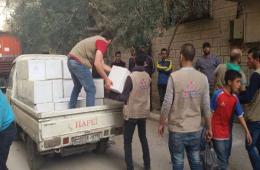 The Two Relief Institutions of Nour and Jafra Distribute Food Aid to the Displaced Families from Yarmouk to Yelda Town.