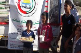 The Palestine Charity Commission in Cooperation with Turkish Organization Fedar Distributed Food Meals on Al Muzareeb Residents.
