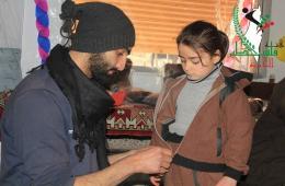 Palestine Charity Association distributes winter clothes to Al-Yarmouk Camp