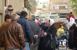 Distributing assistance to Palestinian families in Damascus.    