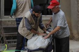 Food aids handed over to residents of Yarmouk camp in southern Damascus