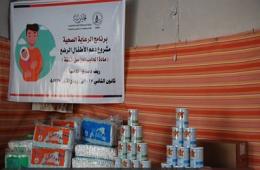 Aids handed out to Palestinian families in Qudsaya, in Rural Damascus
