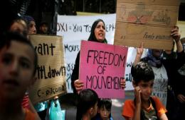 Immigrants from Syria protest in front of the German embassy in Athens