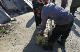 Fuel Supplies Handed Over to Displaced Palestinian Families in Deir Ballout Camp